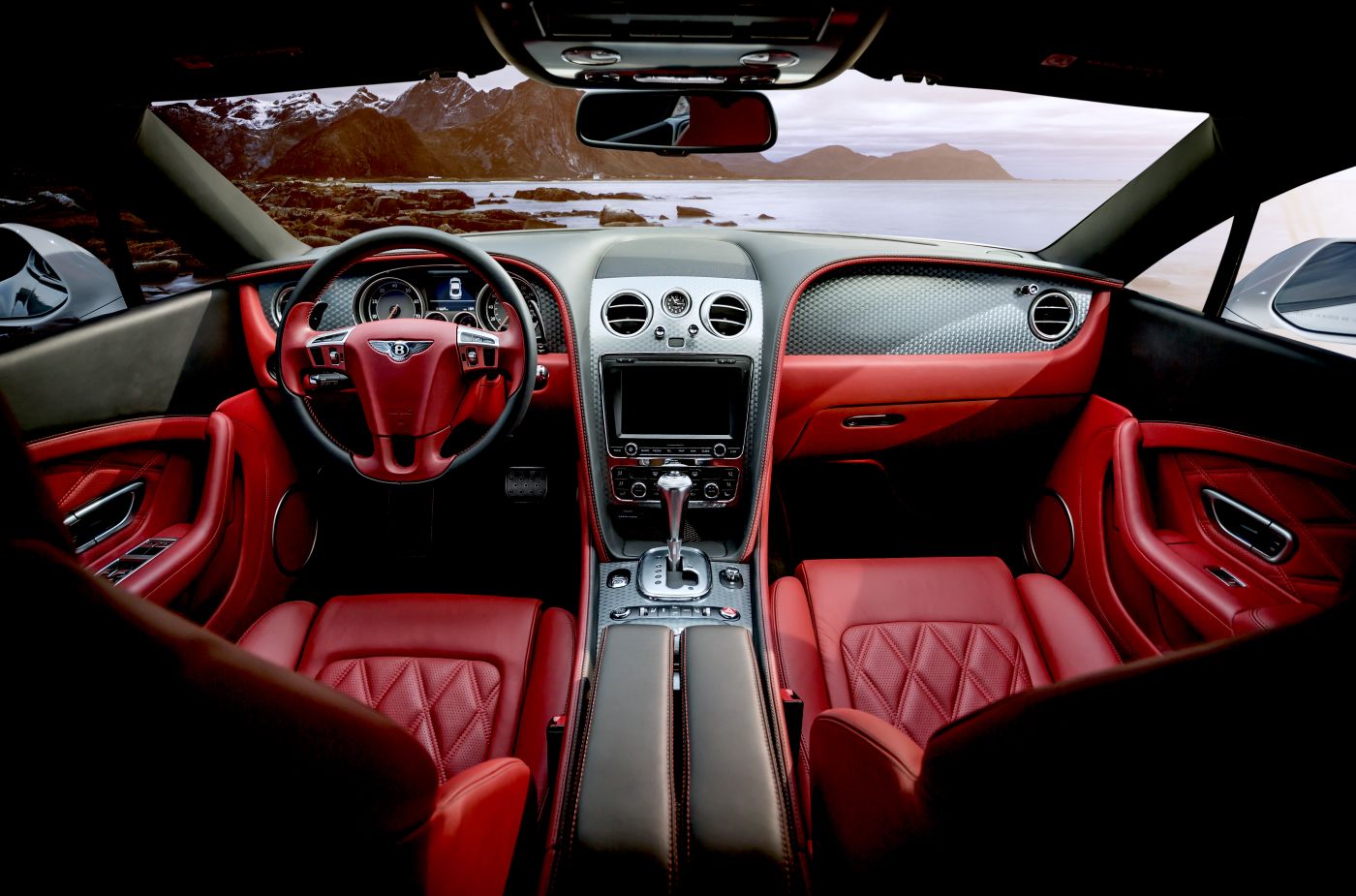 Bentley interior with red leather and polished dashboard details