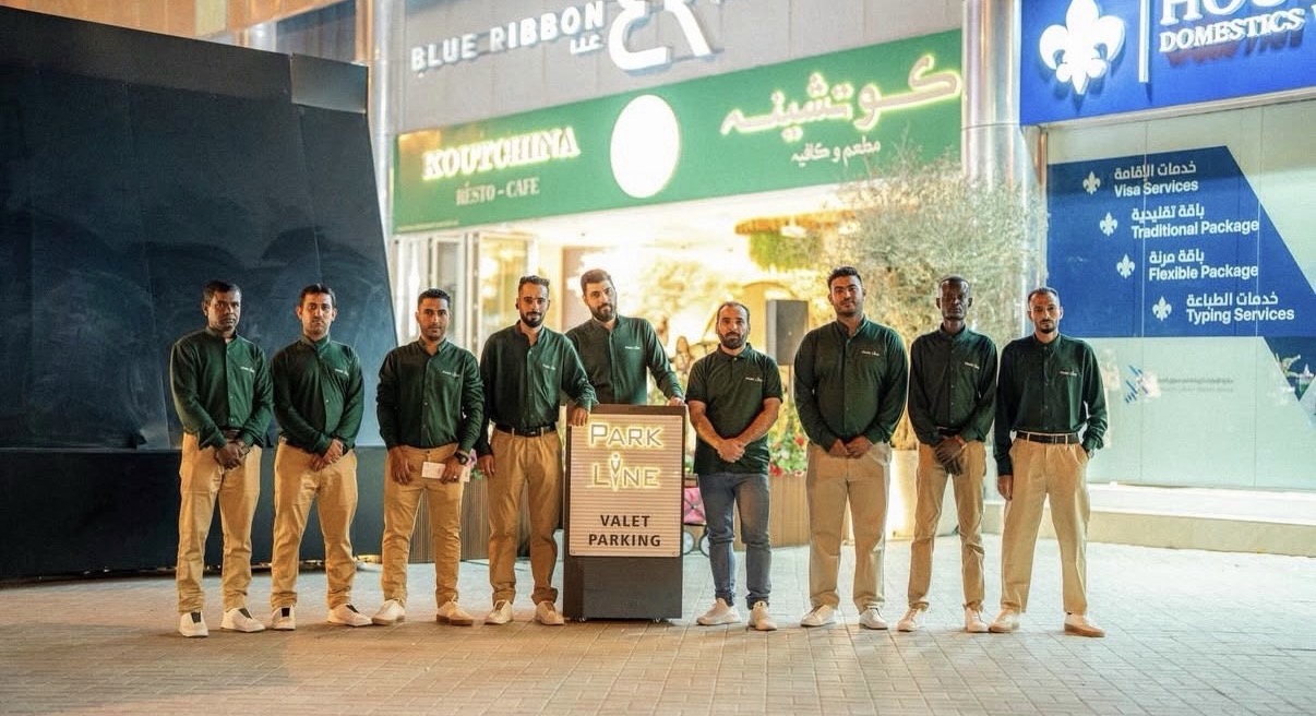 Parkline valet team beside the valet parking stand